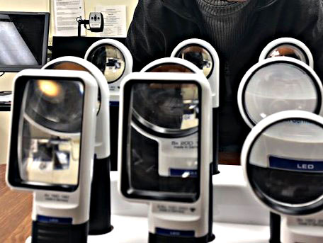 Different strengths of magnifiers, CCTVs in background